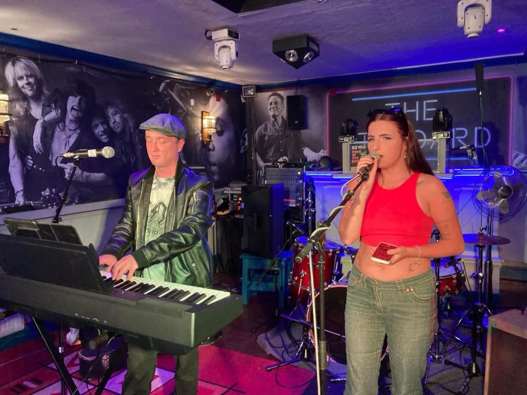 Chris and Aris performing at a gig